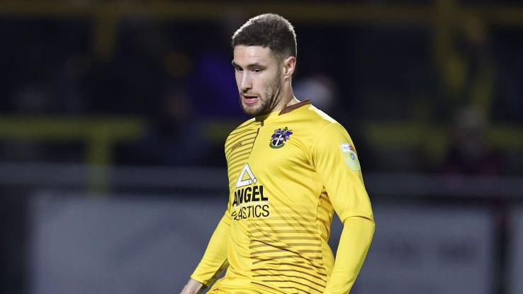 Will Randall in action for Sutton United 