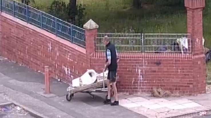 David Thomas dumping waste on a trolley