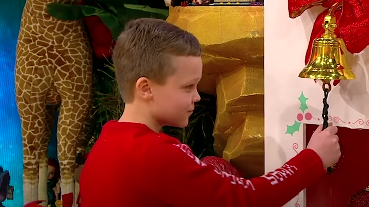 Finn Ryan ringing the bell on the Toy Show