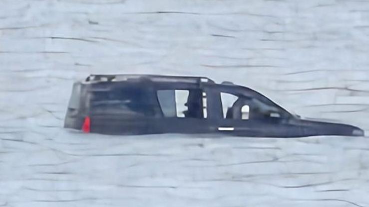 A 4x4 car cut off by the sea at Cleethorpes