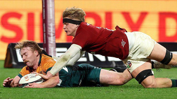 Henry Pollock dives to score a try