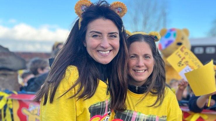 Amy Garcia and Lindsey Burrow smile and look at the camera