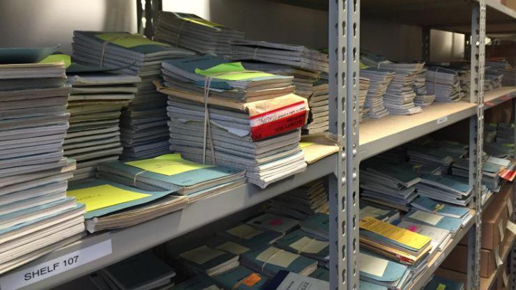 The Hillsborough archive at the IOPC’s Warrington office. There are notebooks piled high on shelves. Some are bound together with elastic bands.