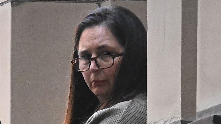 Erin Patterson during trial in Melbourne wearing glasses and her dark her down.