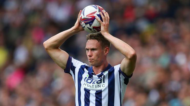 Torbjorn Heggem prepares to take a throw-in for West Bromwich Albion