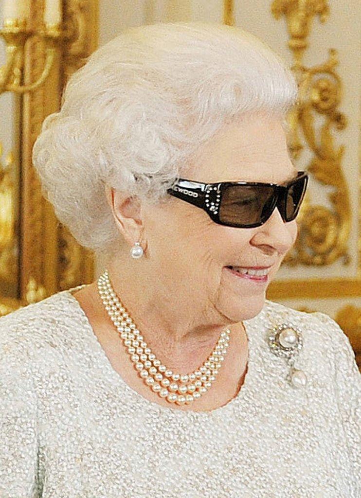 The Queen wearing 3D glasses.