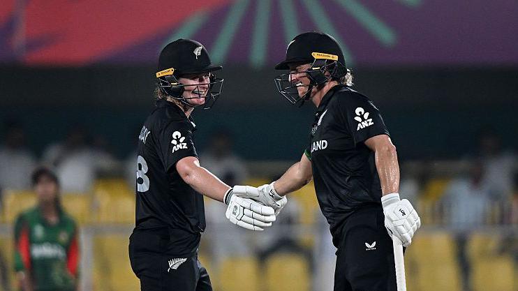 Brooke Halliday and Sophie Devine shake hands during their 112-run partnership