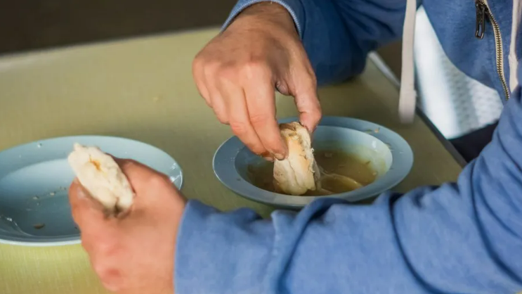 Generic photo of someone eating soup