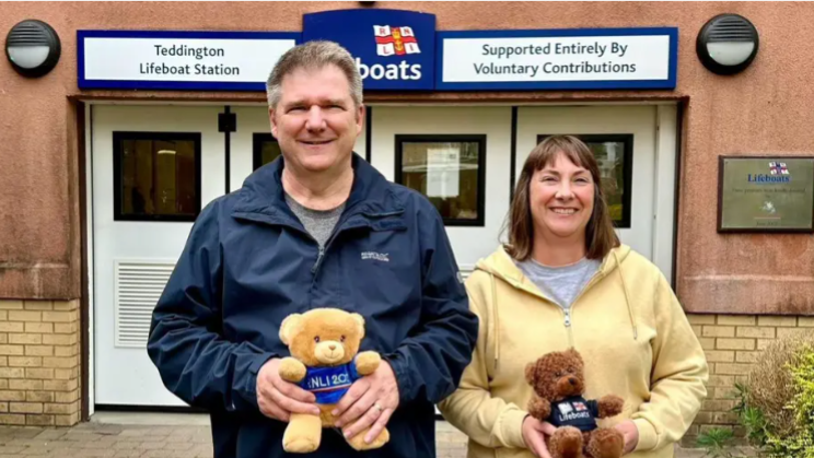 Allan and Helen Thornhill at Teddington RNLI, both are holding RNLI teddies