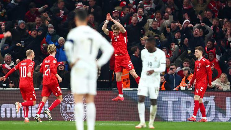 Rasmus Hojlund celebrates scoring for Denmark