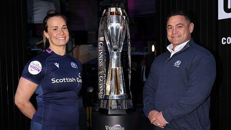Rachel Malcolm, captain of Scotland and Sione Fukofuka, new head coach of Scotland, pose for a photo with the trophy