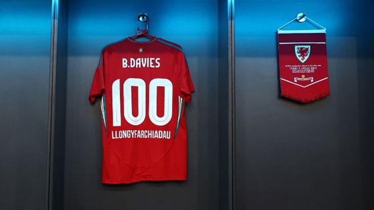 A Ben Davies 100 caps celebration shirt hangs in the Wales dressing room
