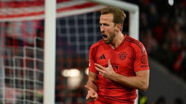 Harry Kane celebrates scoring his hat-trick