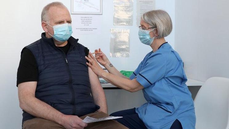 Man getting Covid vaccination 