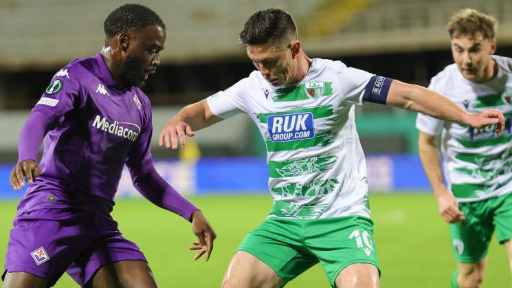 Jonathan Ikonè of Fiorentina and Daniel Redmond of The New Saints battle for the ball during their Conference League match last October