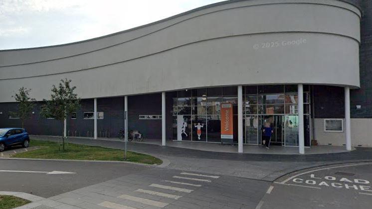 The exterior of Bridlington's sports centre. The atrium features a wave-like design, with a glass frontage