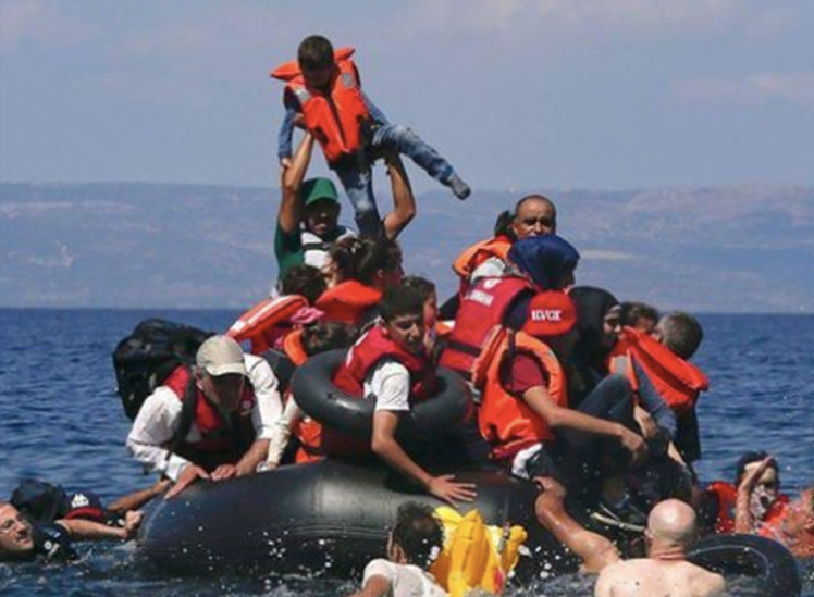 Boy held aloft from sea