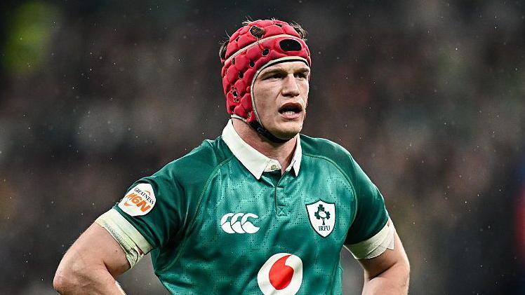 Josh van der Flier stands with hands on hips