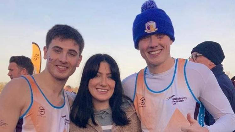 Cian Adams (left), their sister Kennedy and brother Jordan