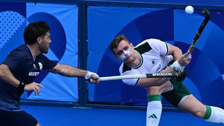 Ireland's Lee Cole gets his strike away against Argentina in the Pool B match