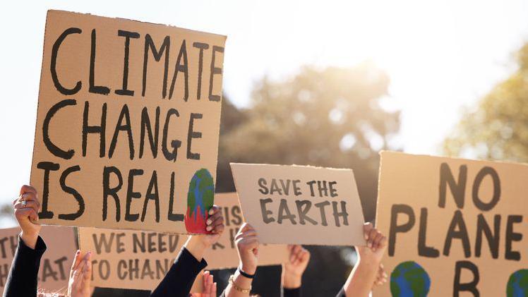 Shot of a group of people protesting climate change 