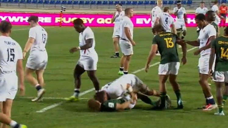 Seb Kelly makes contact witht head of Luan Giliomee on the floor in a still from the match