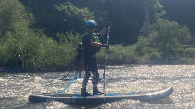 Len paddling on the river