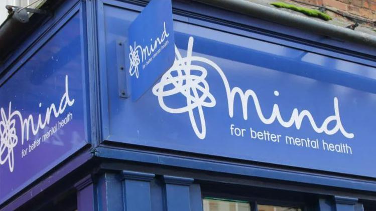 A building with a Mind sign on the front and corner 