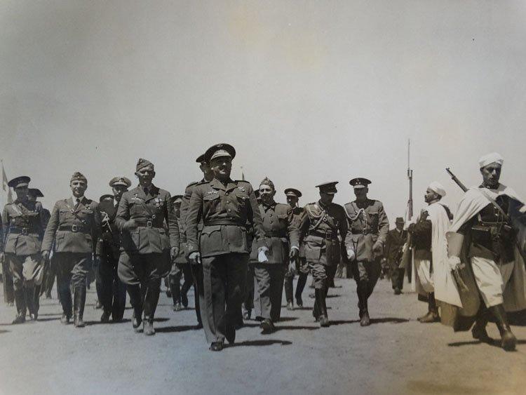 General Franco marches flanked by troops and von Richthofen at the Barajas airport, Madrid.