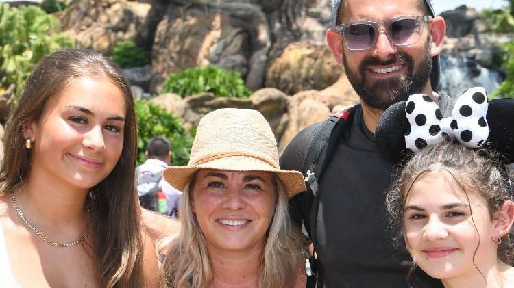 A family picture of four people on holiday at Disney World, Orlando. 