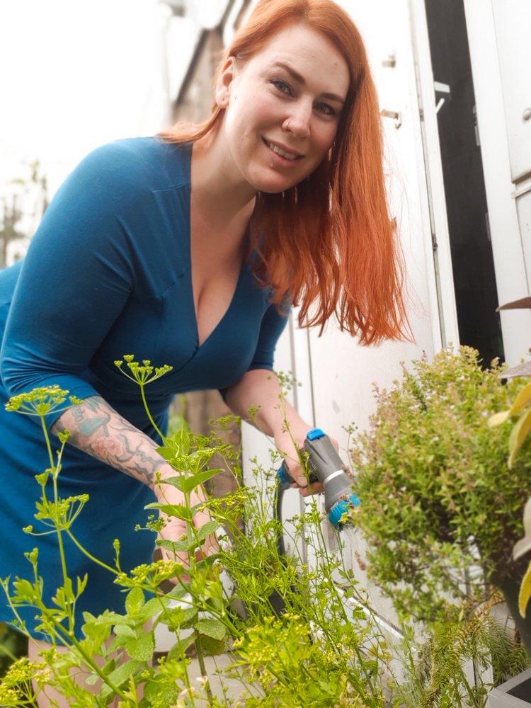 Sheila watering herbs