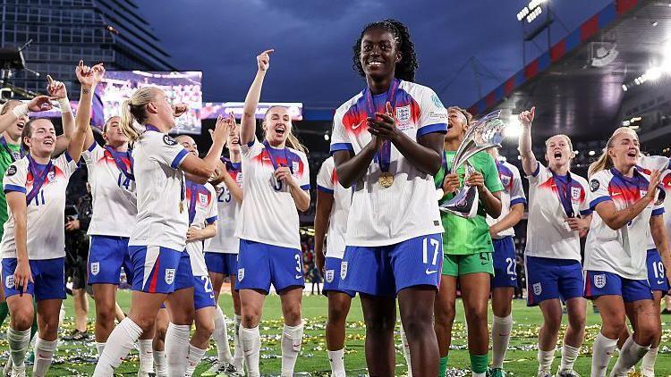 Michelle Agyemang applauding in front of the England squad after winning Euro 2025