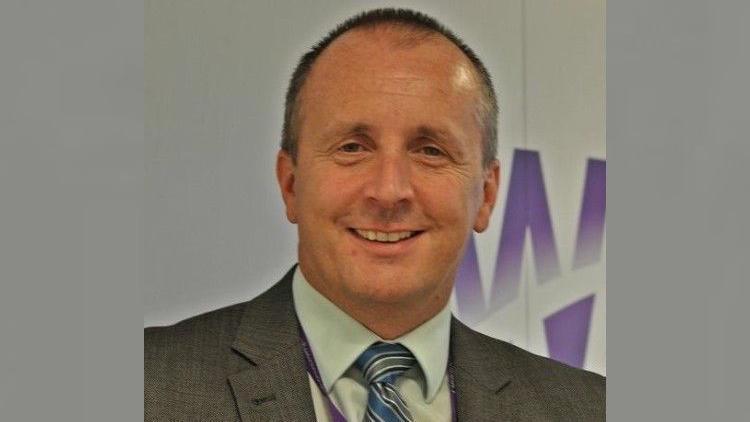 Image of Dave in a suit and tie.