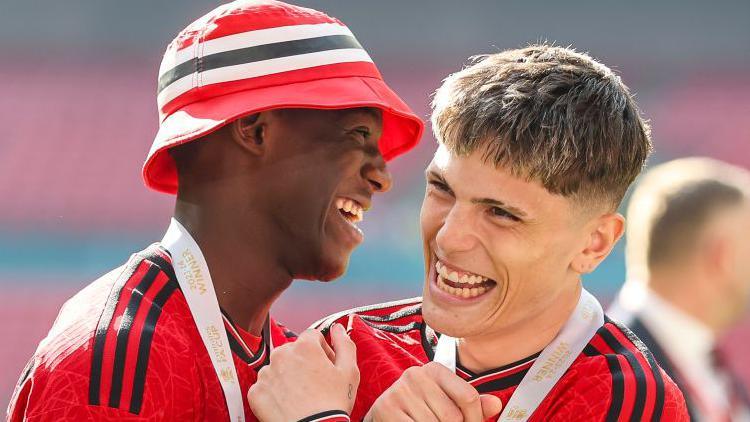 Kobbie Mainoo and Alejandro Garnacho celebrate Manchester United's FA Cup final win over Manchester City in May 2024
