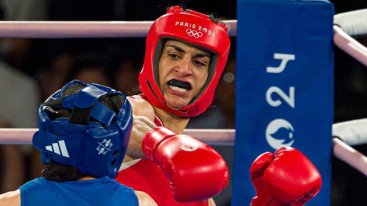 Imane Khelif delivers a right hook to China's Liu Yang in the final of the welterweight boxing event at Paris 2024