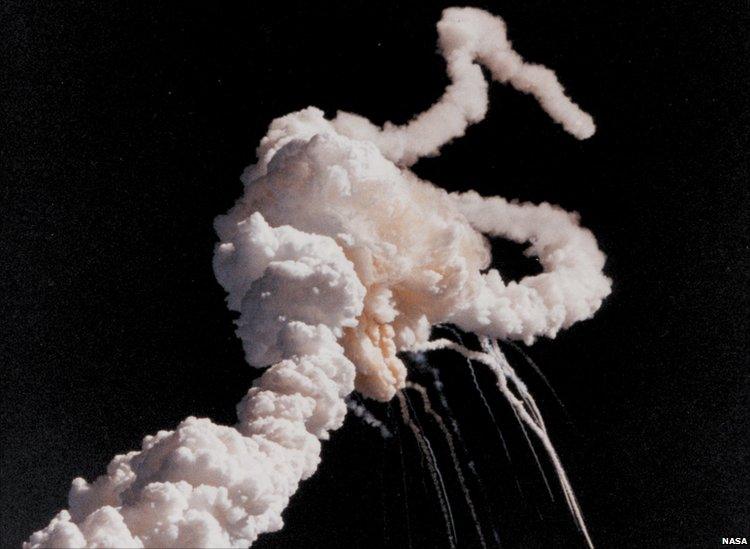 Taken a few seconds after the accident this picture shows the Space Shuttle Main Engines and Solid Rocket Booster exhaust plumes entwined around a ball of gas from the External Tank