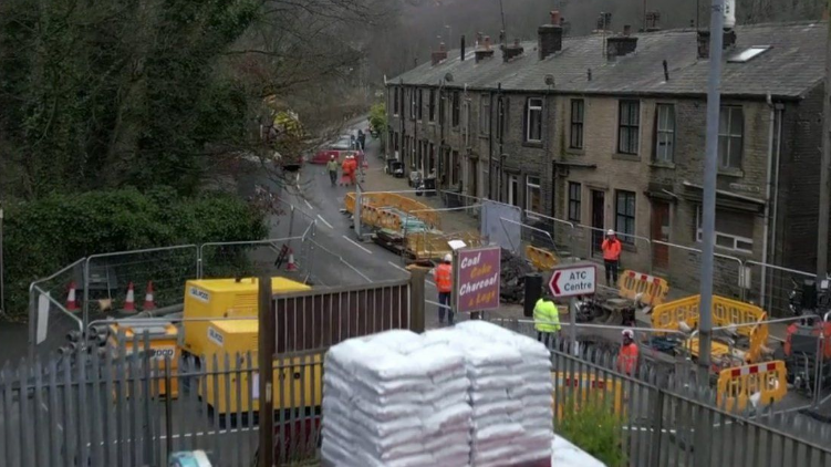 A shot of a busy road near Hebden Bridge with road works 