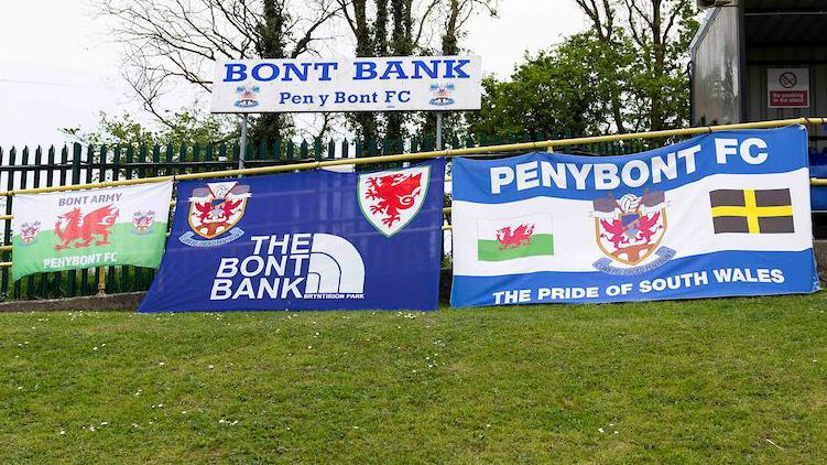 Penybont FC flags displayed at a game