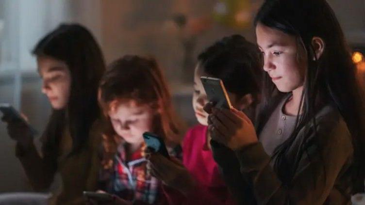 Children using phones.