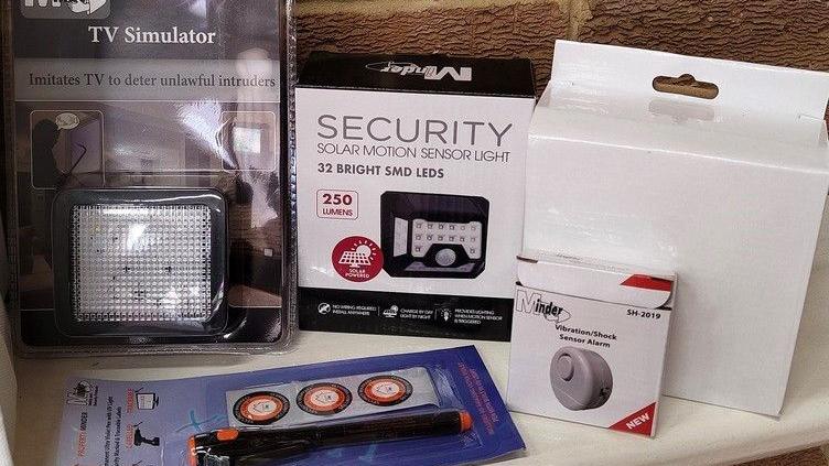 Some of the items included in the security packs: A TV Simulator which imitates the light from a TV to deter unlawful intruders, a solar motion sensor light, a vibration sensor alarm and other items.