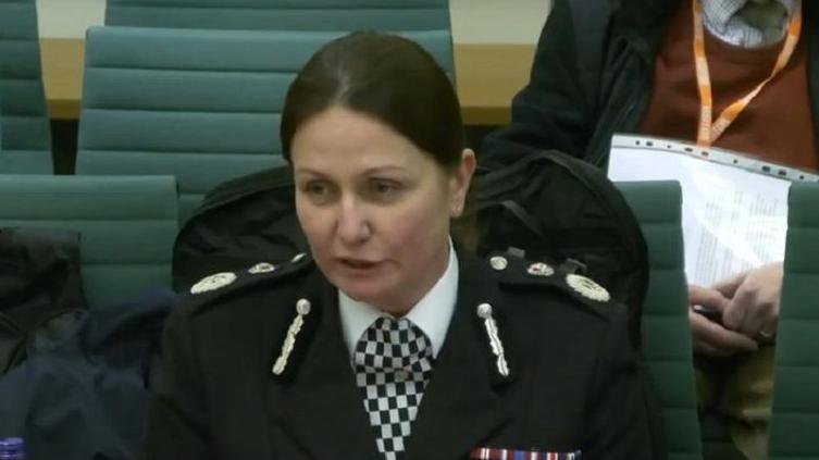 A screengrab of Lauren Poultney, Chief Constable of South Yorkshire Police, speaking to MPs. She has dark hair tied back and is wearing her police uniform.