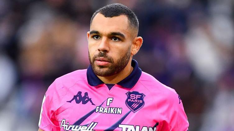 Joe Marchant wearing a pink Stade Francais kit