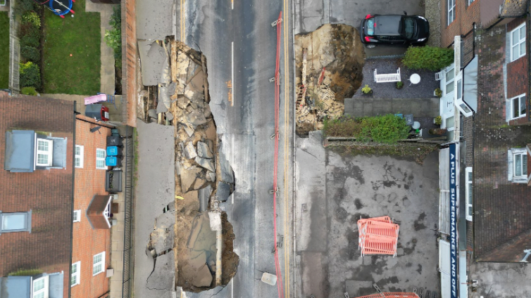 A drone view shows a large sinkhole in Godstone