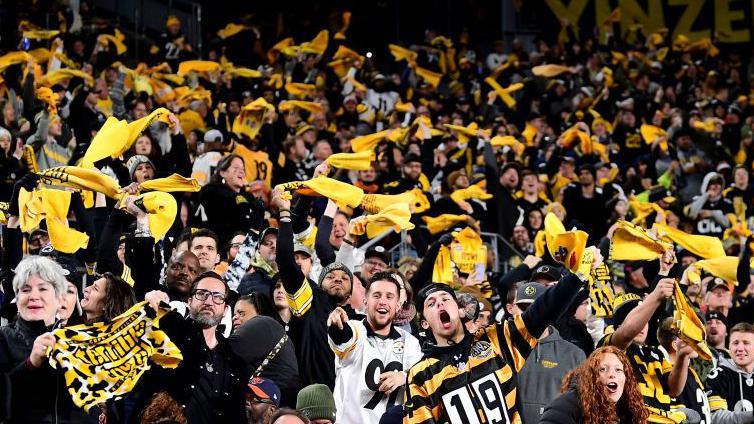 Pittsburgh Steelers fans wave terrible towels during a game against the Chicago Bears in November 2021