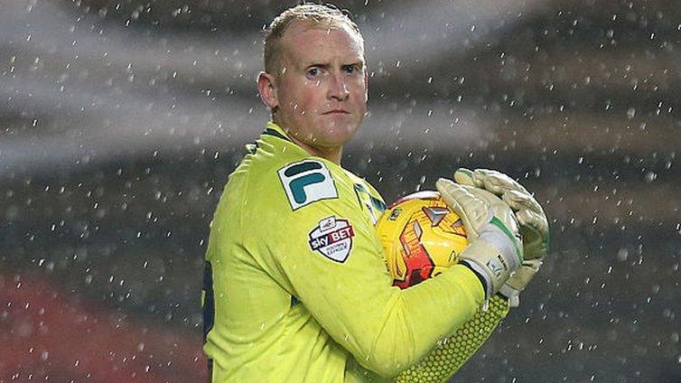 Conrad Logan in action for Rochdale