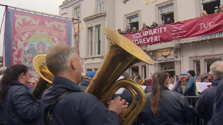 Rain-soaked crowds gathered to watch as the 138th Durham Miners' Gala wound its way through the streets in July