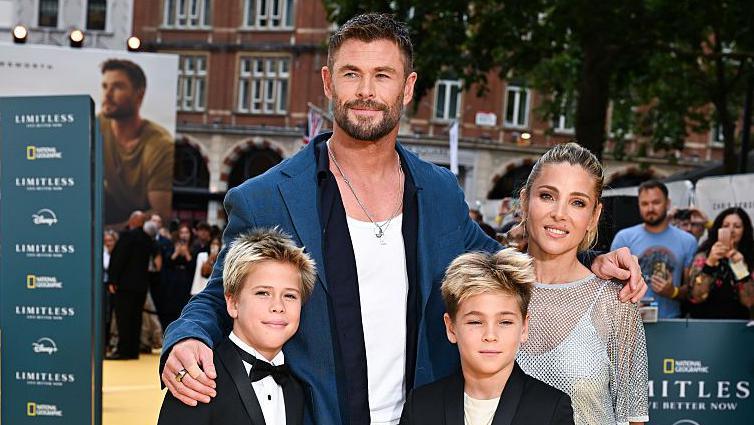 Chris Hemsworth and Elsa Pataky with Tristan Hemsworth (L) and Sasha Hemsworth attend the Limitless: Live Better Now UK Premiere in London earlier this year. Hemsworth is wearing a blue blazer and white T-shirt.
