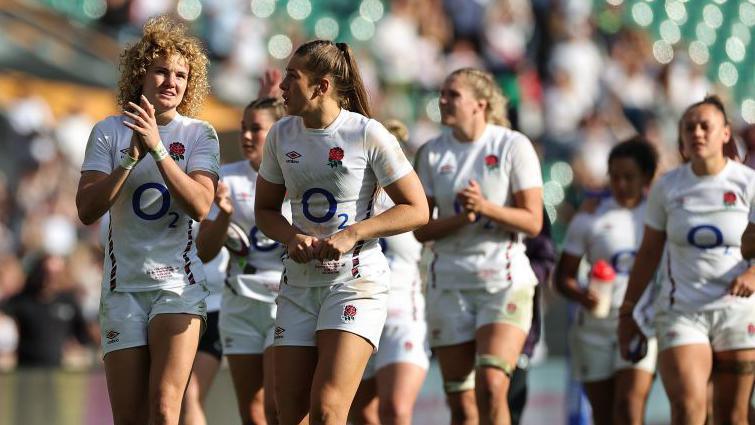 England's players celebrate after beating New Zealand at Twickenham in September.