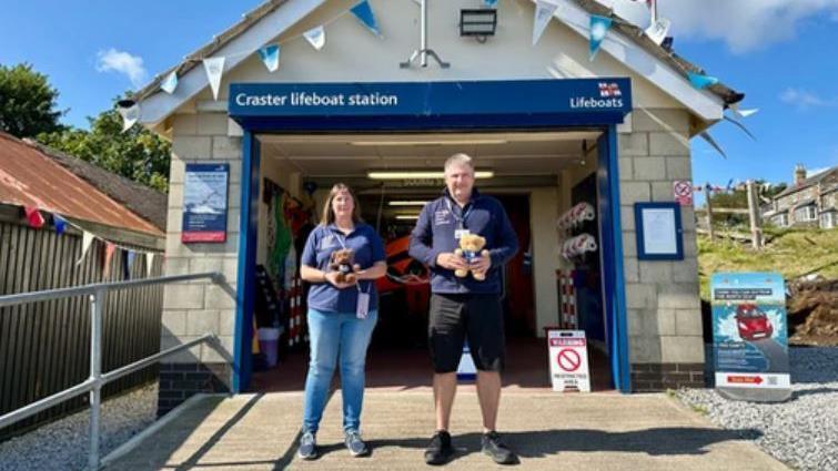 Allan and Helen Thornhill outside Craster lifeboat station 