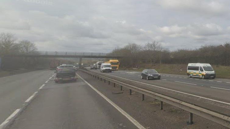 Part of the A14 near Thrapston showing cars and lorries travelling on both carriageways